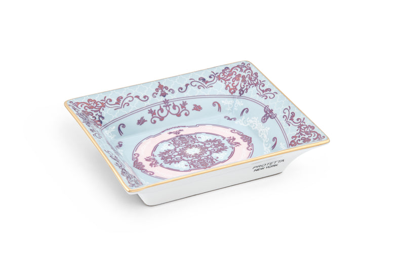 A miniature masterpiece, Sleek porcelain tray with rich gold borders, perfect for enhancing any room’s decor.
